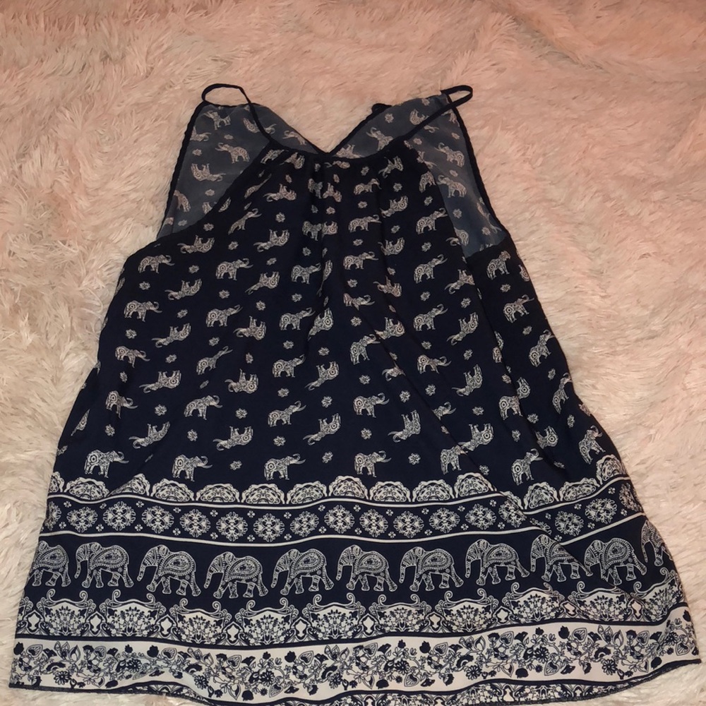 An detailed spaghetti strap shirt with elephants